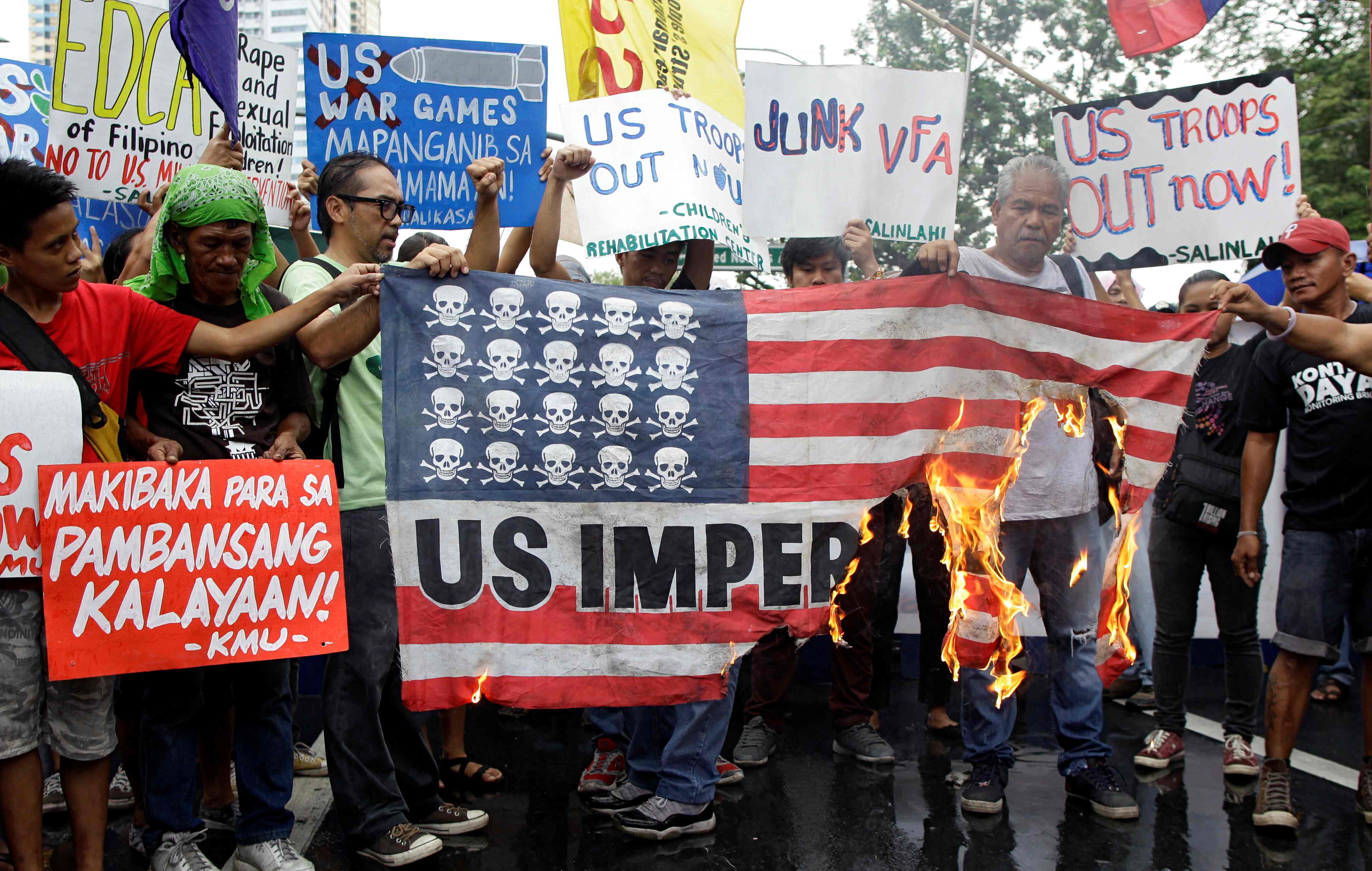 Demonstrators burn a mock U.S. flag during a rally opposing the U.S.-Philippines joint military exercises outside the U.S. embassy in Manila, Philippines on October 4, 2016. REUTERS/Czar Dancel/File Photon