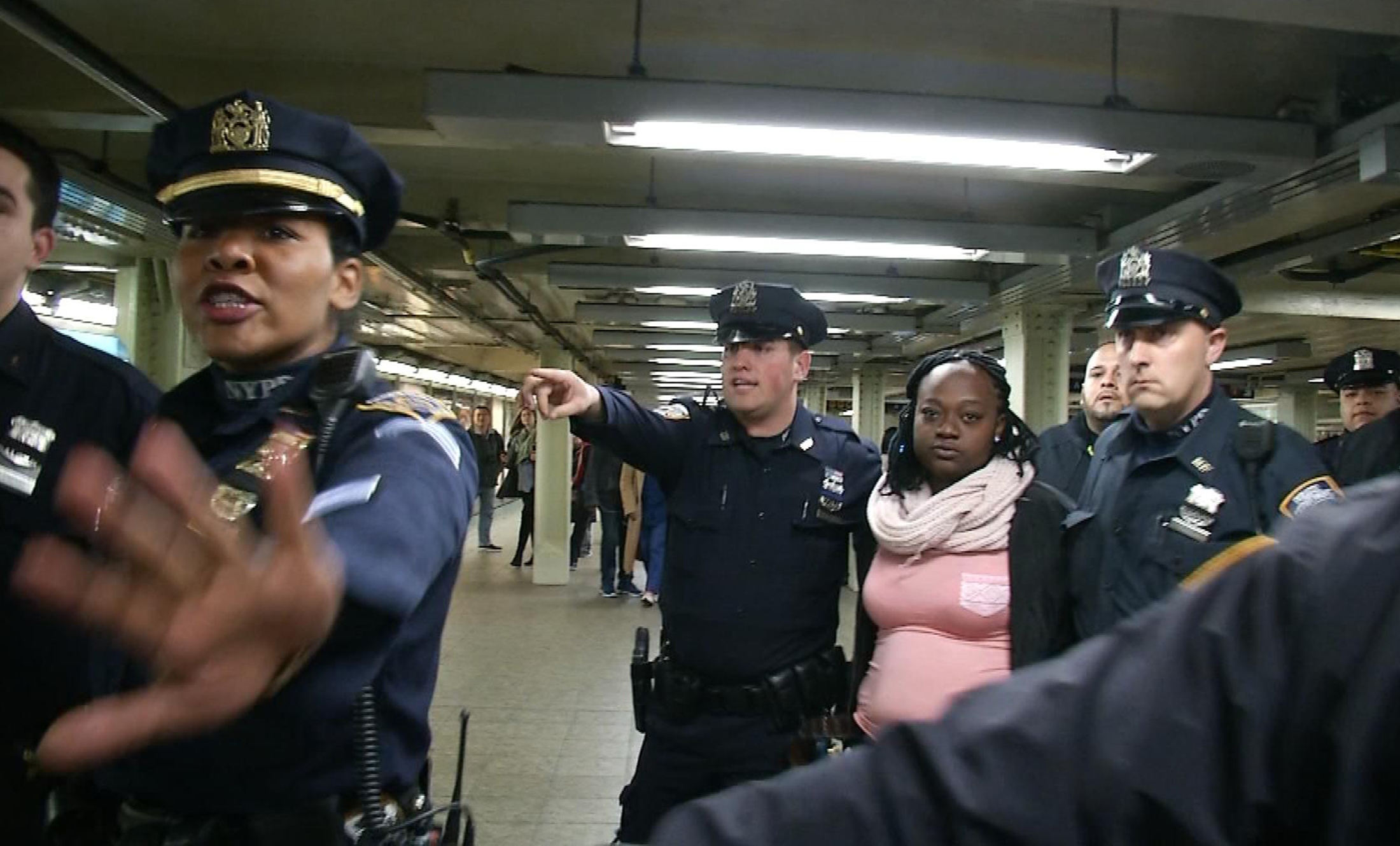 New York City police arrest a woman after a commuter was pushed in front of a subway train as it arrived at a Times Square train platform in New York, New York, in this still image from video taken November 7, 2016. REUTERS/James Carmann