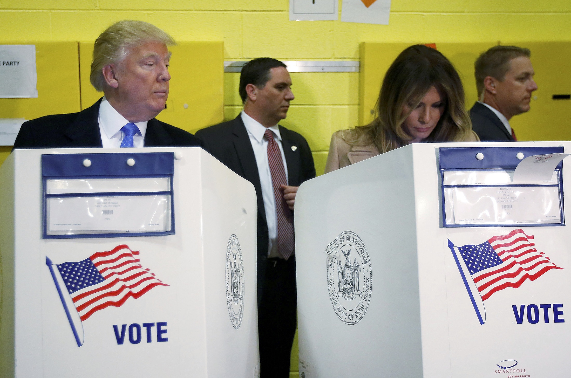 Republican presidential nominee Donald Trump and his wife Melania Trump vote at PS 59 in New York, New York, U.S. November 8, 2016. REUTERS/Carlo Allegrin