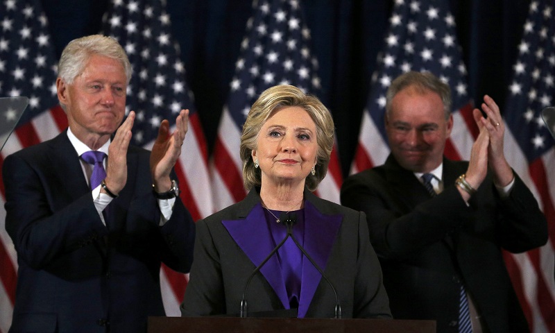 Hillary Clinton addresses her staff and supporters about the results of the U.S. election as former U.S. President Bill Clinton (L) and her running mate Tim Kaine applaud at a hotel in the Manhattan borough of New York, U.S., November 9, 2016. REUTERS/Car