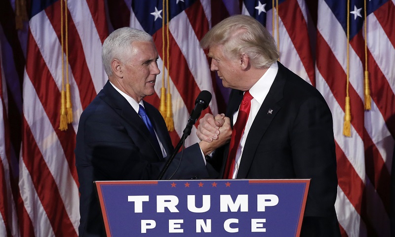 Donald Trump greets his running mate Mike Pence during his election night rally in Manhattan. REUTERS/Mike Segar
