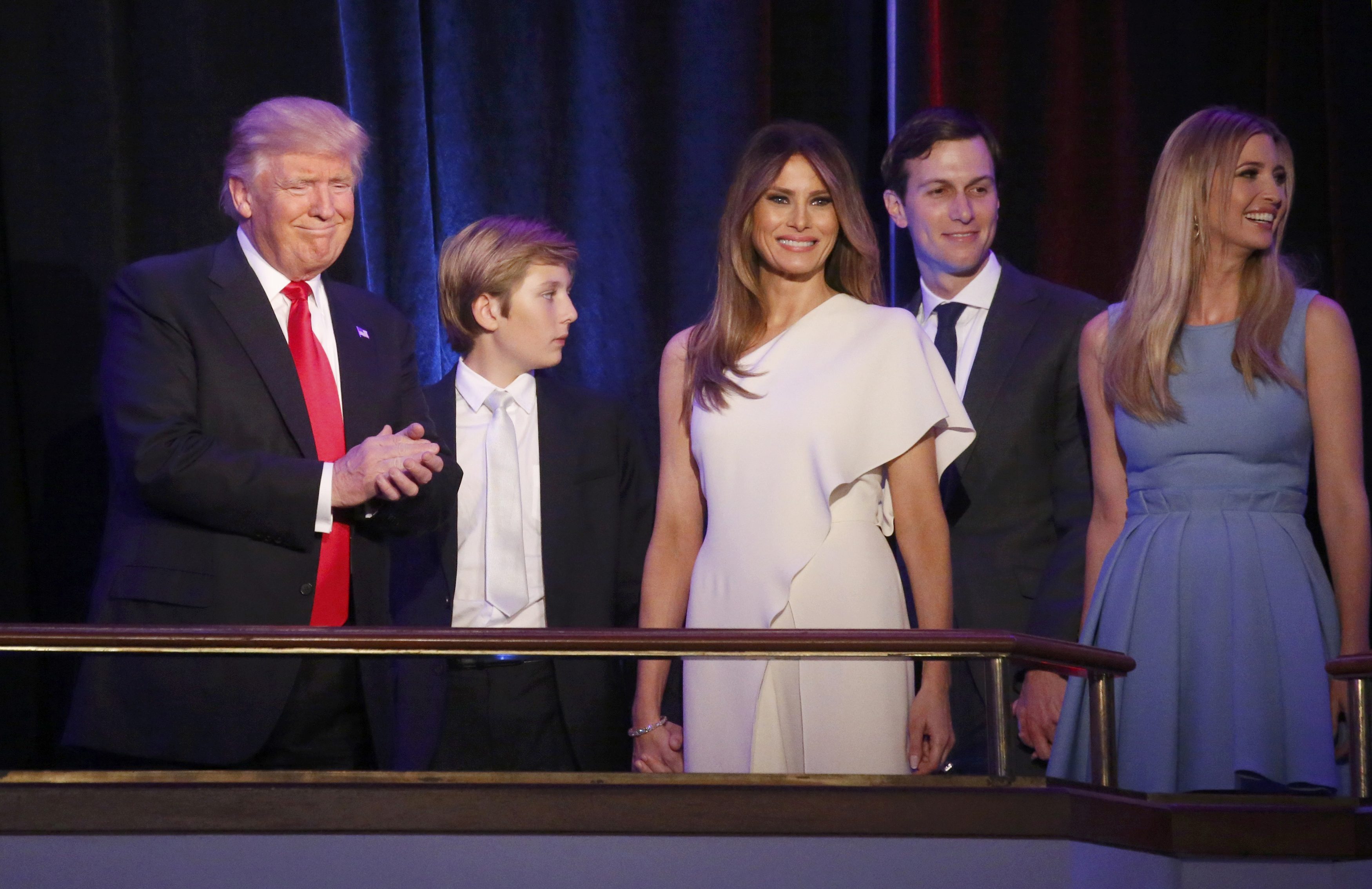 Republican U.S. president-elect Donald Trump stands with his son Barron (C), wife Melania, son-in-law Jared Kushner and daughter Ivanka Trump at his election night rally in Manhattan, New York, U.S., November 9, 2016. REUTERS/Carlo Allegrin