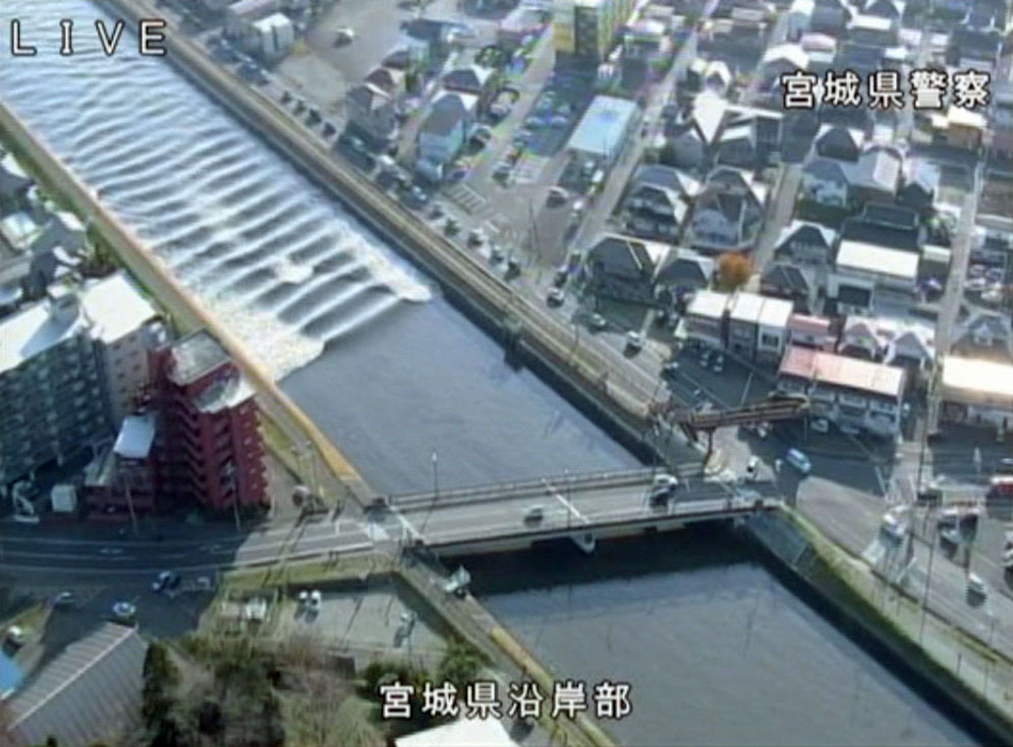 A tidal surge is seen in Sunaoshi River after tsunami advisories were issued following an earthquake in Tagajo, Miyagi prefecture, Japan November 22, 2016, in this video grab image released by Miyagi Prefectural Police via Kyodo. Mandatory credit Miyagi P