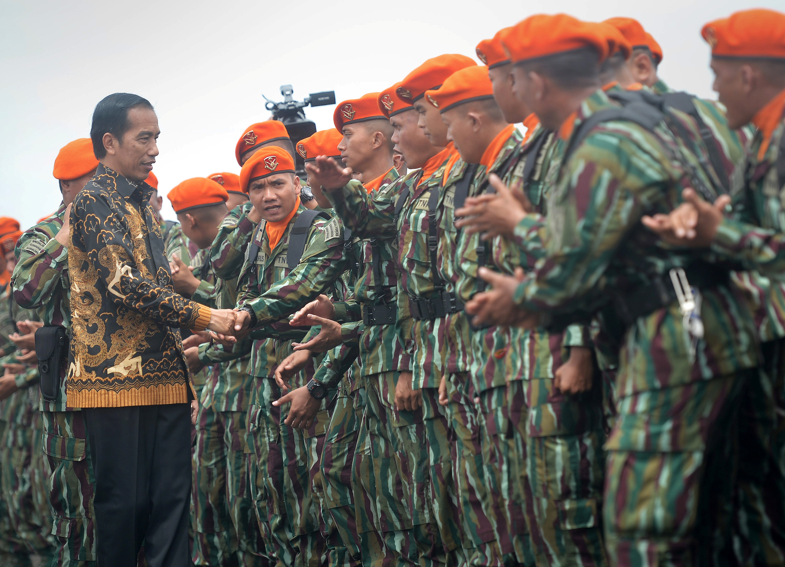 Indonesia President Joko Widodo (L) shakes hands with special unit of Indonesia Air Force soldiers in Bandung, Indonesia West Java province, November 15, 2016 in this photo taken by Antara Foto. Antara Foto/Yudhi Mahatma/ via REUTERSATTENTION EDITORS - TH