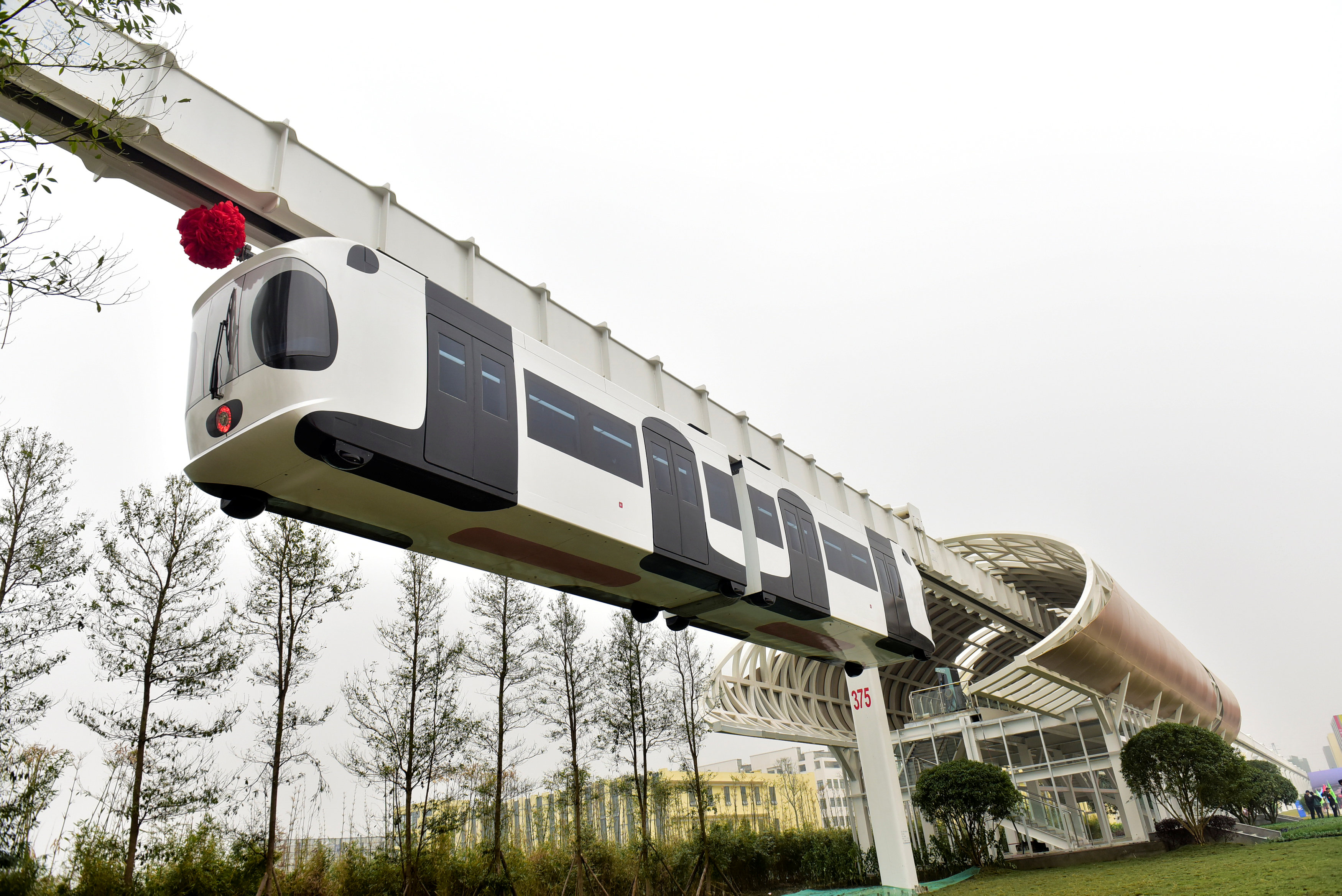 A test line of a new energy suspension railway, resembling a giant panda, is seen in Chengdu, Sichuan Province, China, November 21, 2016. Picture taken November 21, 2016. China Daily/via REUTERS ATTENTION EDITORS - THIS IMAGE WAS PROVIDED BY A THIRD PARTY