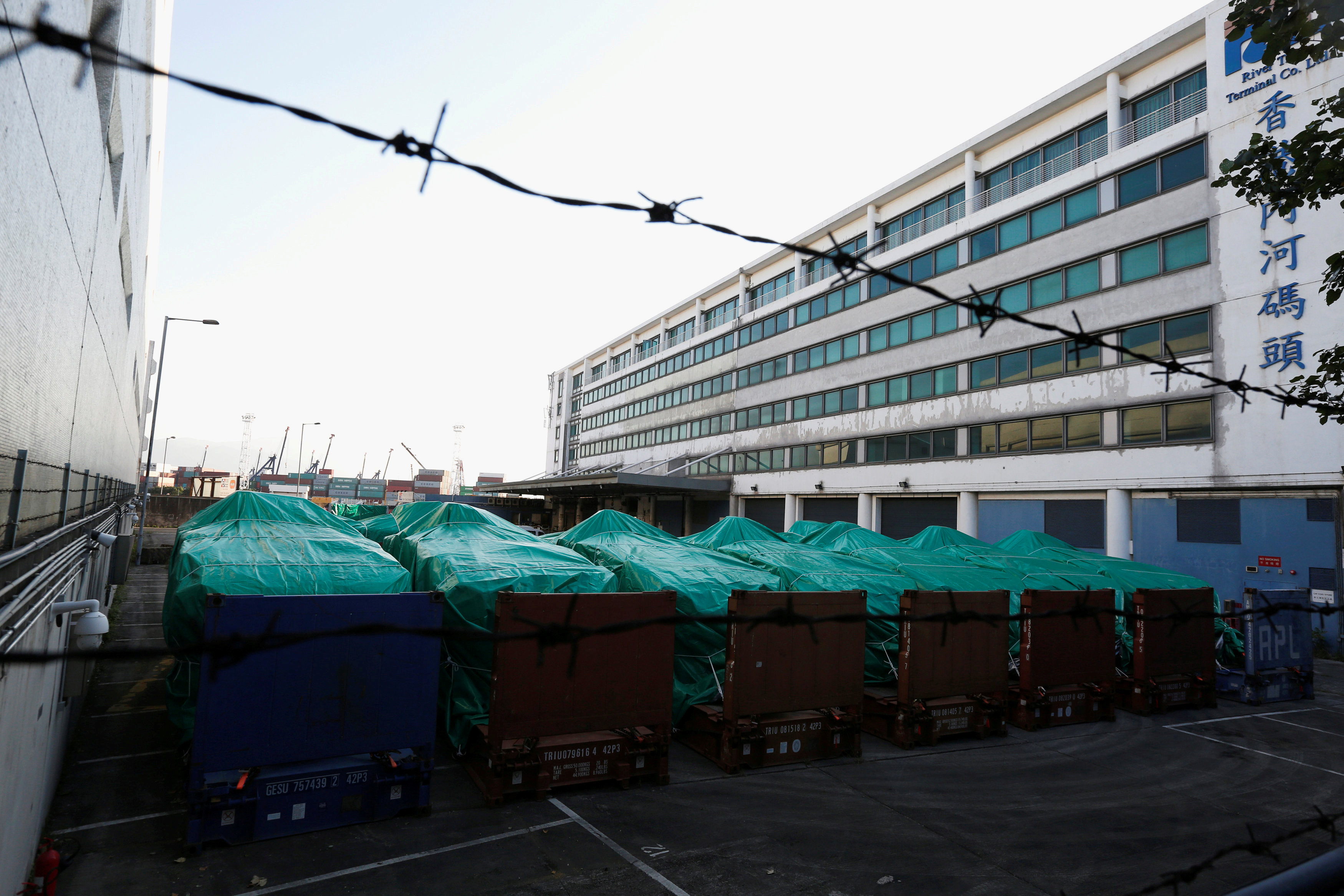 Armored troop carriers, belonging to Singapore, are detained at a cargo terminal in Hong Kong, China November 28, 2016. REUTERS/Bobby Yip TPX IMAGES OF THE DAYn