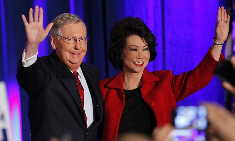 U.S. Senate Minority Leader Mitch McConnell (R-KY) waves to supporters with his wife, former United States Secretary of Labor Elaine Chao, at his midterm election night rally in Louisville, Kentucky, November 4, 2014. REUTERS/John Sommers II