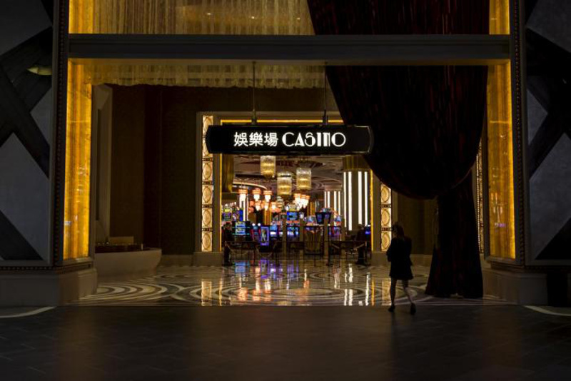 A woman walks in front of a casino at Studio City in Macau, China, October 27, 2015. u00e2u20acu201d Reuters pic