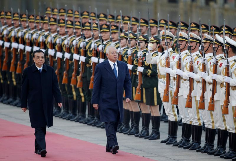 Prime Minister Datuk Seri Najib Razak (right) and China's Premier Li Keqiang inspect honour guards during a welcoming ceremony at the Great Hall of the People in Beijing, November 1, 2016. u00e2u20acu2022 Reuters pic