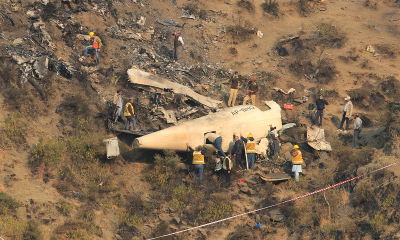Rescue workers survey the site of a plane crashed a day earlier near the village of Saddha Batolni, near Abbotabad, Pakistan, December 8, 2016. u00e2u20acu201d Reuters pic