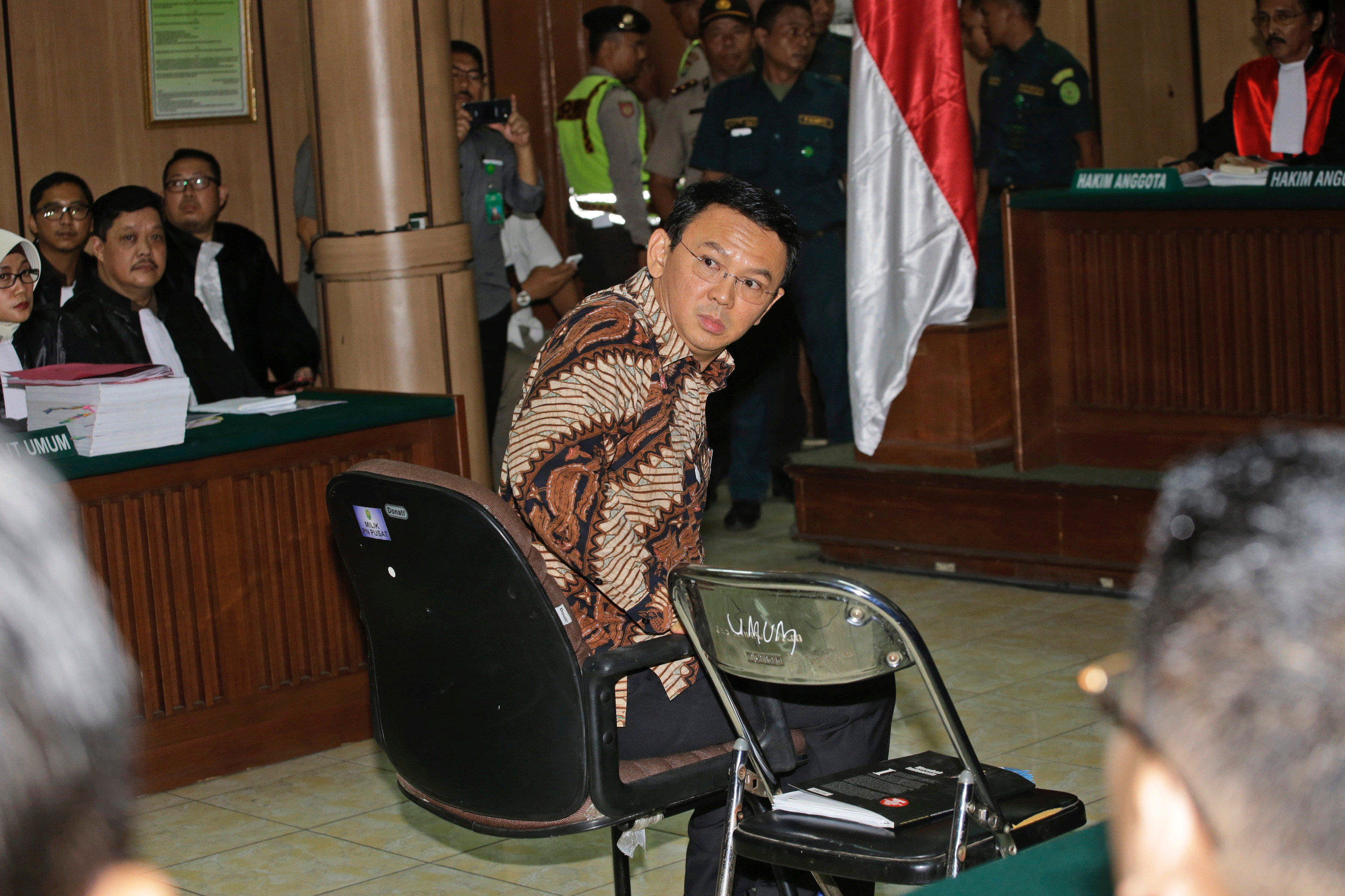 Jakarta Governor Basuki Tjahaja Purnama, popularly known as ,Ahok,, sits on the defendant's chair at the start of his trial hearing at North Jakarta District Court in Jakarta, Indonesia, Tuesday, Dec. 13, 2016. REUTERS/Tatan Syuflana/Pooln