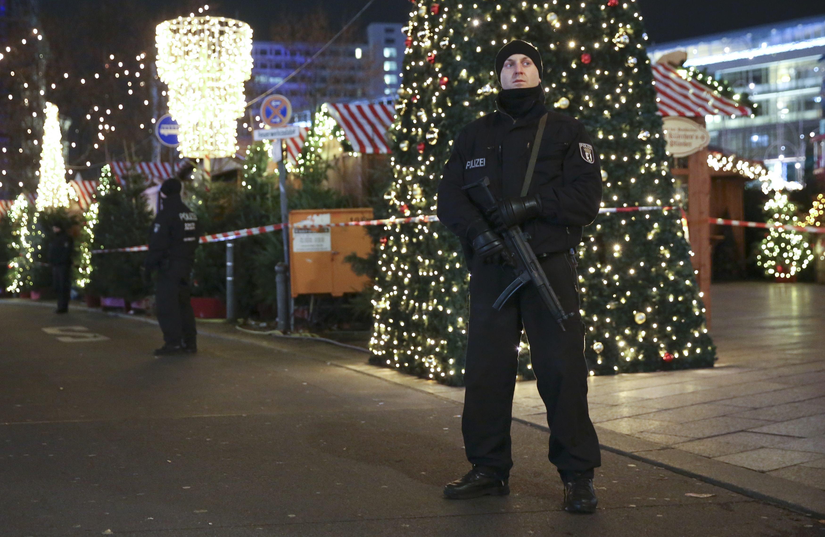 German police officers secure the site of an accident with a truck at a Christmas market on Breitscheidplatz square near the fashionable Kurfuerstendamm avenue in the west of Berlin, Germany, December 19, 2016. REUTERS/Christian Mangn