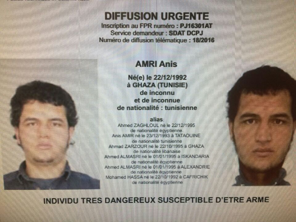 A police record with the title, ,Urgent Distribution, (Top) and ,Very dangerous individual who could be armed, (Bottom) shows suspect Anis Amri who is sought in relation with Monday's truck attack on a Christmas market in Berlin. POLICE RECORD OBTAINED VI