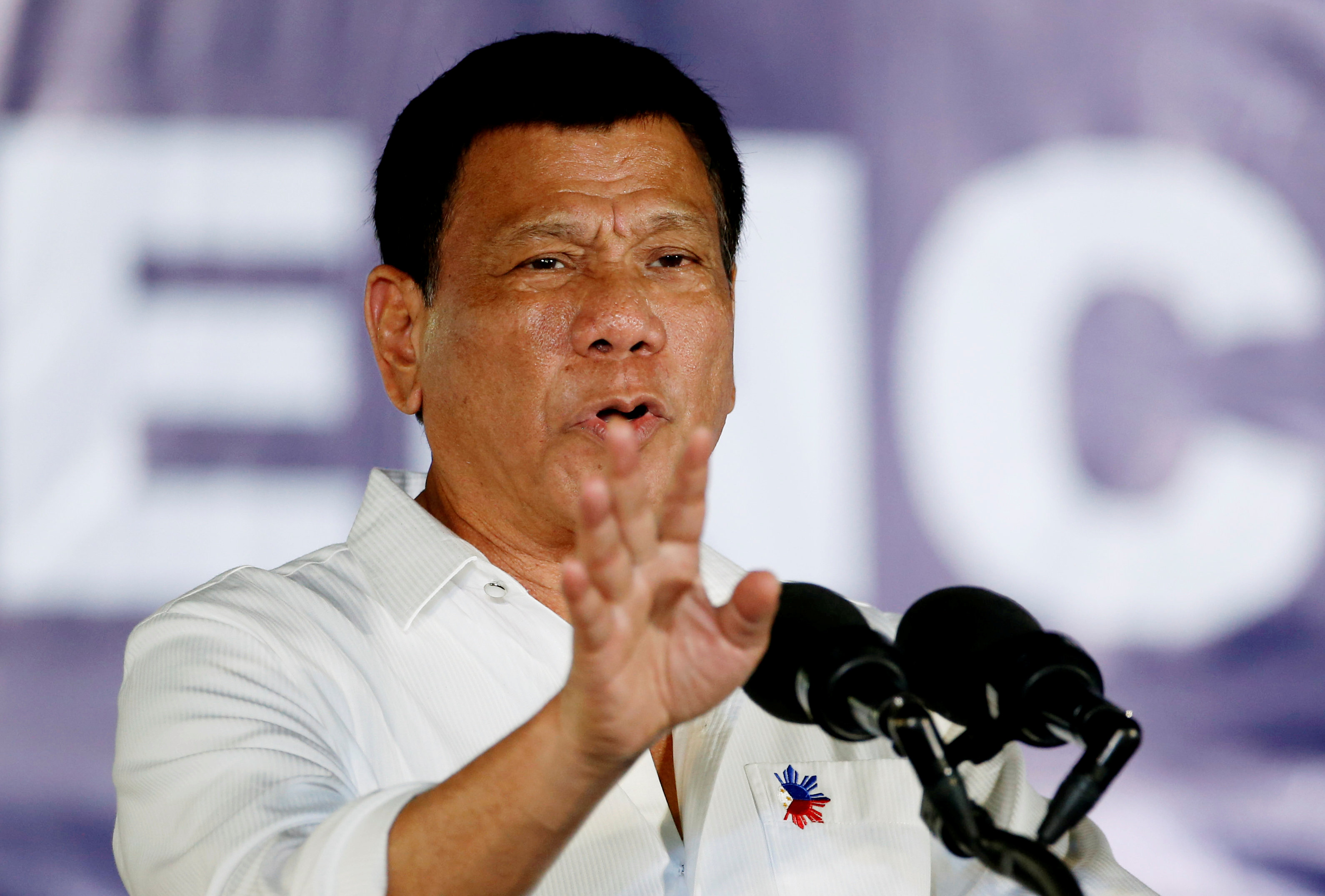 President Rodrigo Duterte speaks in front of housewives and mothers, that participate in the anti-illegal drugs campaign of the provincial government and Duterte's war on drugs at Clark Freeport Zone in Pampanga, Philippines December 22, 2016. REUTERS/Eri