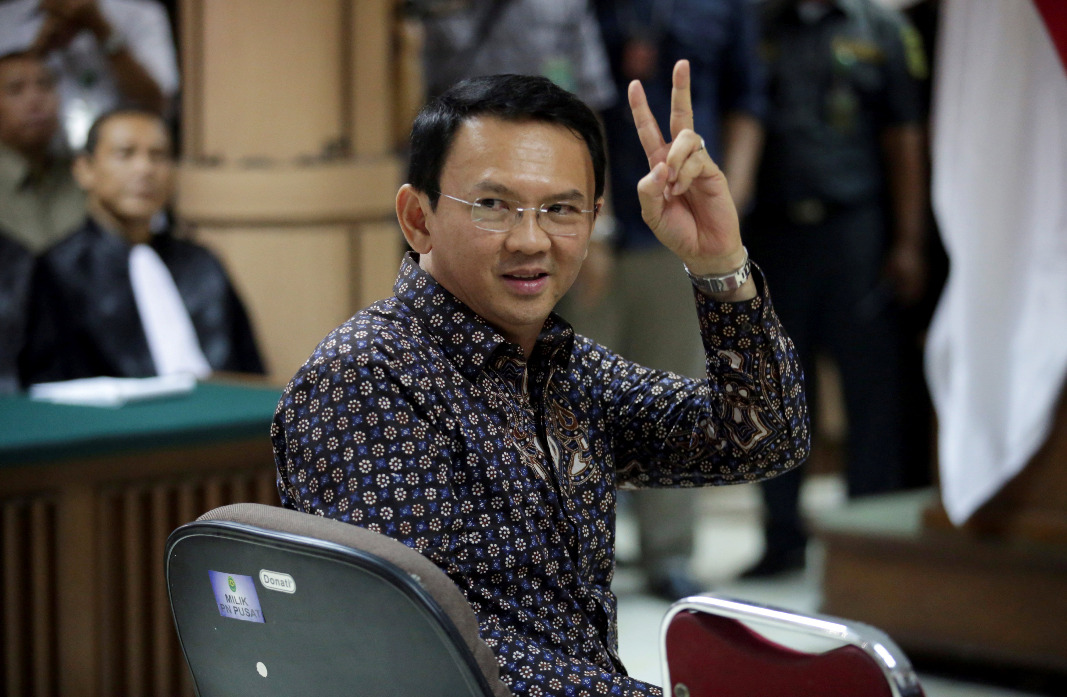 Jakarta's Governor Basuki Tjahaja Purnama gestures inside the courtroom during his blasphemy trial at the North Jakarta District Court in Jakarta, Indonesia, December 27, 2016. REUTERS/Bagus Indahono/Pool TPX IMAGES OF THE DAYn