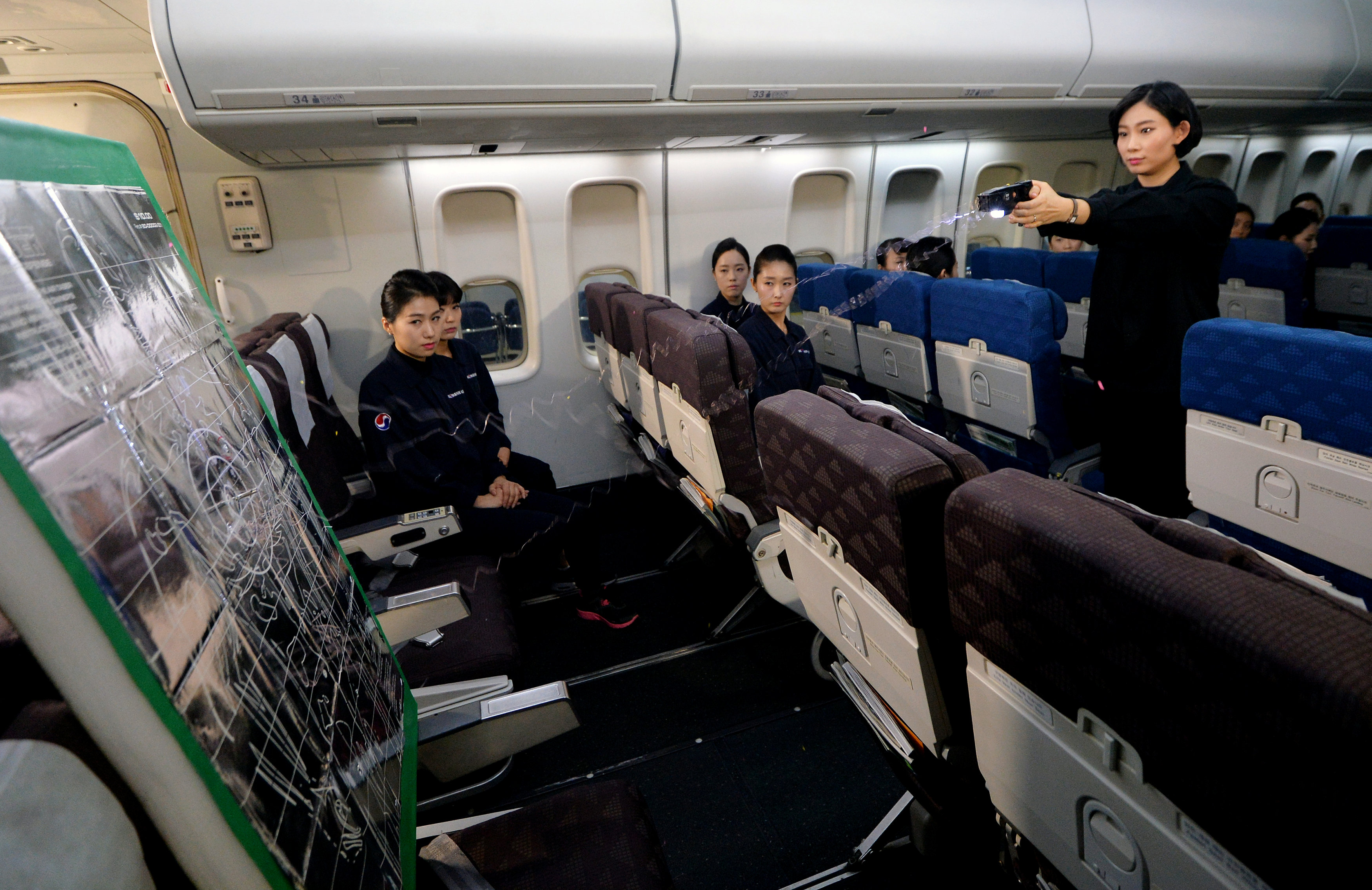 Cabin crews attend a training session on how to manage in-flight disturbances in Seoul, South Korea, December 27, 2016. Oh Dae-il/News1 via REUTERS ATTENTION EDITORS - THIS IMAGE HAS BEEN SUPPLIED BY A THIRD PARTY. SOUTH KOREA OUT. FOR EDITORIAL USE ONLY.