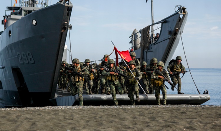 Philippine marines with the Joint Rapid Reaction Force (JRRF), conduct an amphibious landing utilizing Philippine logistical navy ships to seize a scenario-based objective as part of Exercise Balikatan 2016, in Antique, Philippines, April 11, 2016. The JR