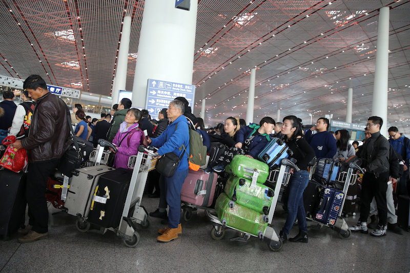 Passengers wait to check in luggage as Beijing Capital International Airport suffers a large-scale flight delays during a polluted day in Beijing December 20, 2016. u00e2u20acu201d Reuters pic
