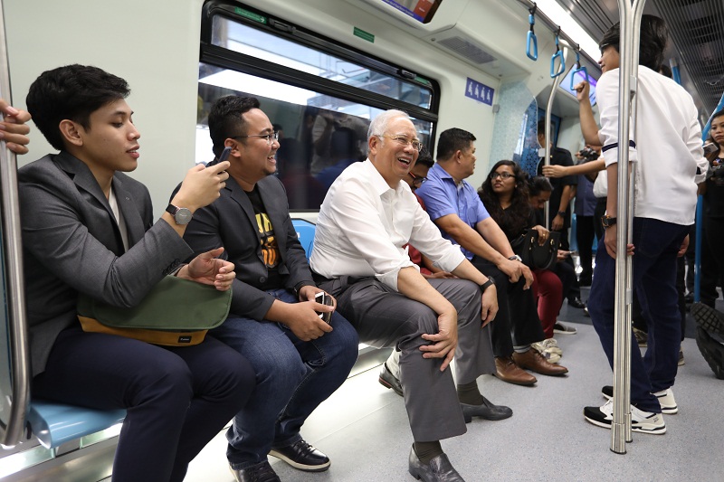 Prime Minister Datuk Seri Najib Razak (centre) together with his online friends ride on the MRT from the Mutiara Damansara station to the Pusat Bandar Damansara station in Kuala Lumpur December 9, 2016. u00e2u20acu201d Bernama pic