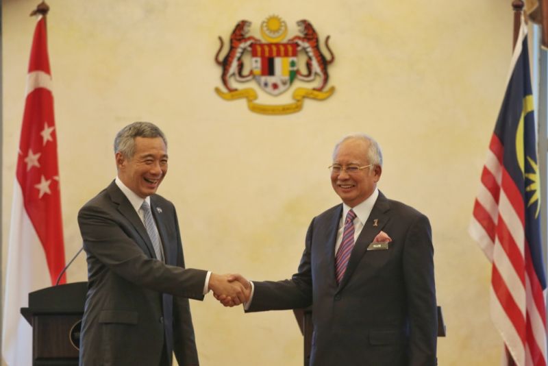 Datuk Seri Najib Razak and Singapore Prime Minister Lee Hsien Loong shake hands at the signing of the Kuala Lumpur-Singapore High Speed Rail (HSR) agreement in Kuala Lumpur, December 13, 2016. u00e2u20acu2022 Picture by Saw Siow Feng