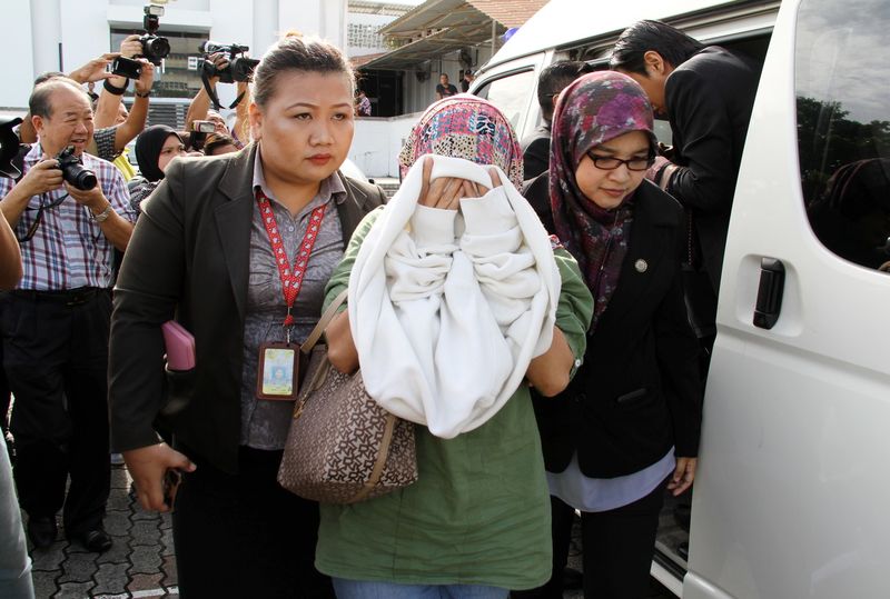 One of the three individuals charged over the misappropriating of infrastructure funds amounting to RM61.48 million in cash and bank savings is pictured getting out of the vehicle at the Kota Kinabalu Sessions Court December 29, 2016. u00e2u20acu201d Bernama pic
