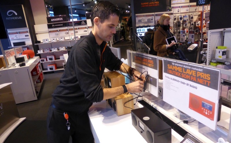 Worker Ino Andre Nilsen arranges digital radios in an Expert City electronics shop in Oslo, Norway January 4, 2017. REUTERS/Alister Doyle