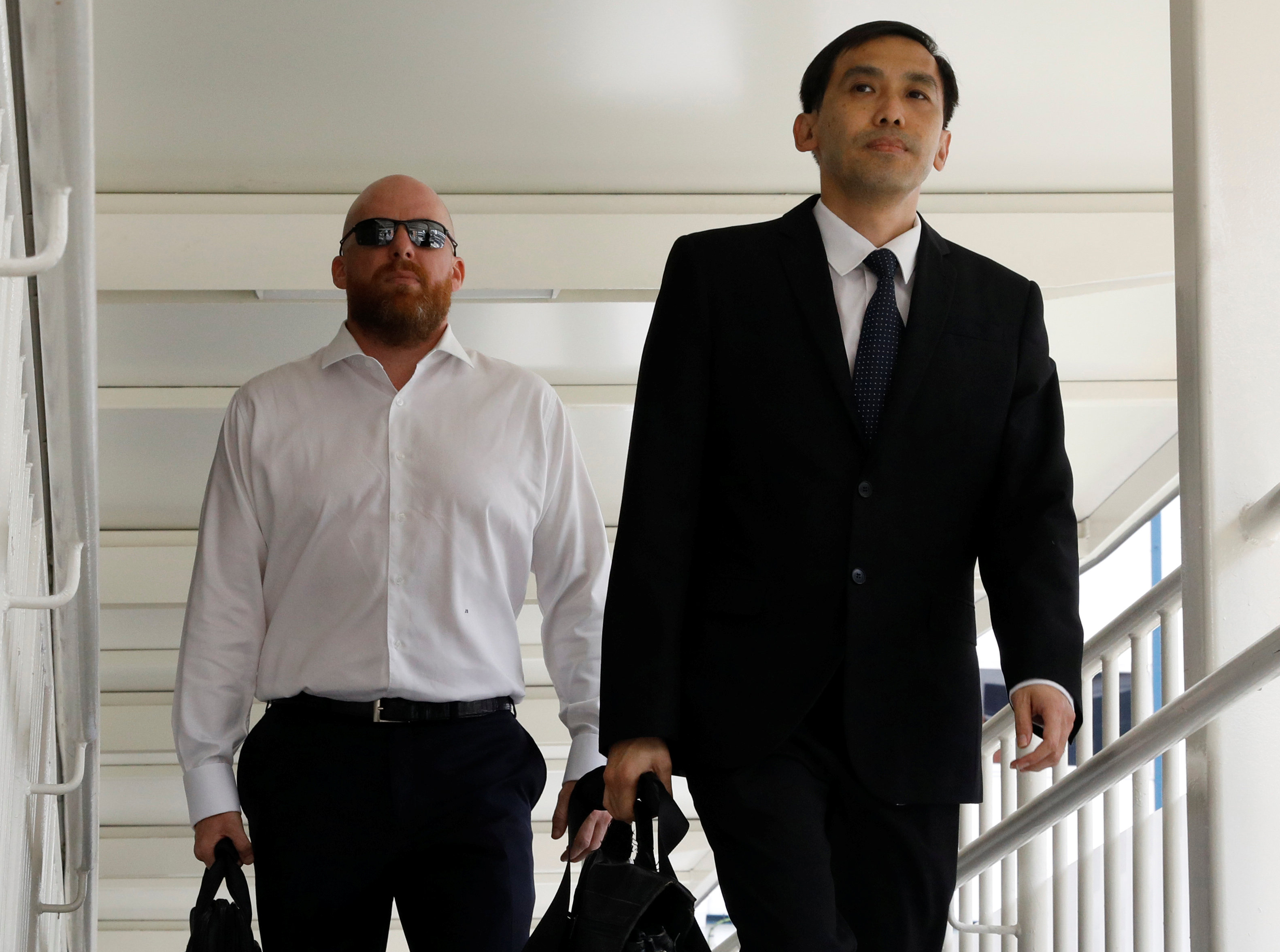 Former local branch manager of Swiss-based Falcon Private Bank AG Jens Sturzenegger arrives at the State Courts with his lawyer Tan Hee Joek in Singapore January 11, 2017. REUTERS/Edgar Sun