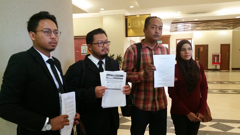 Picture shows (from left) lawyers Adam Luqman and Yusfarizal Yussoff with their clients Mohd Ridhuan Giman and Siti Sarah Maulad Abdullah who are suing JAWI for wrongful khalwat raid and arrest. u00e2u20acu201d Picture by Ida Lim