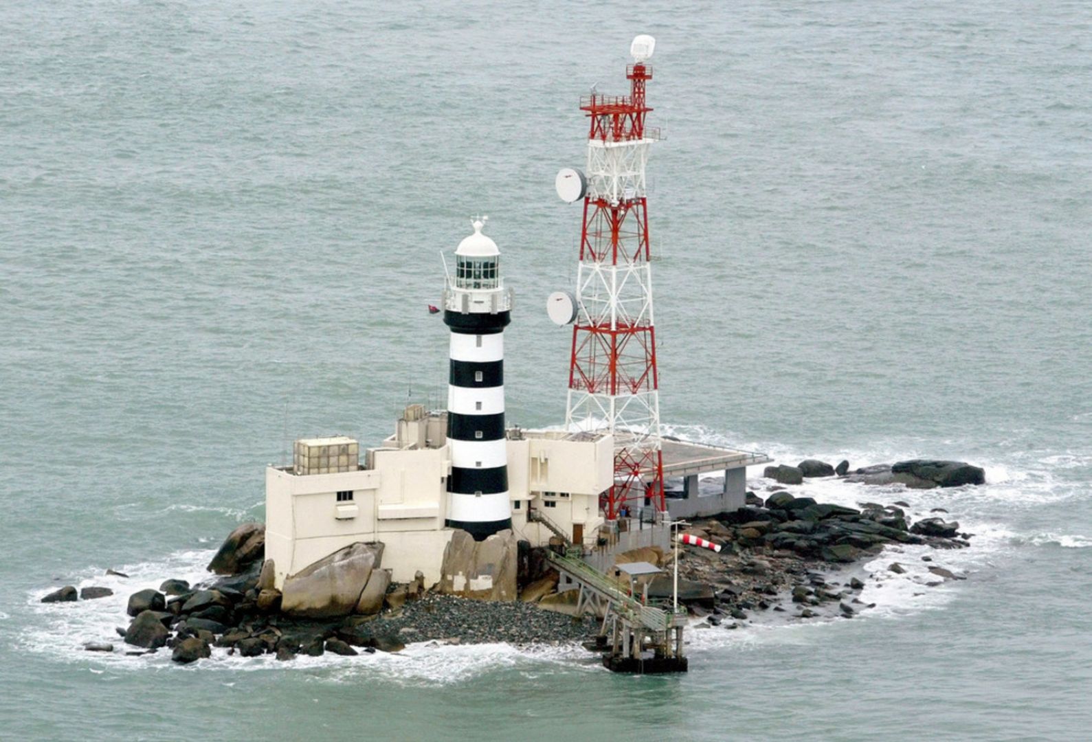 The tiny island of Pedra Branca, where Singapore administers a lighthouse, sits at the entrance to the Singapore Strait about 30km east of the city state and 15km off peninsular Malaysia's southern coast on January 6, 2003. u00e2u20acu201d TODAY pic