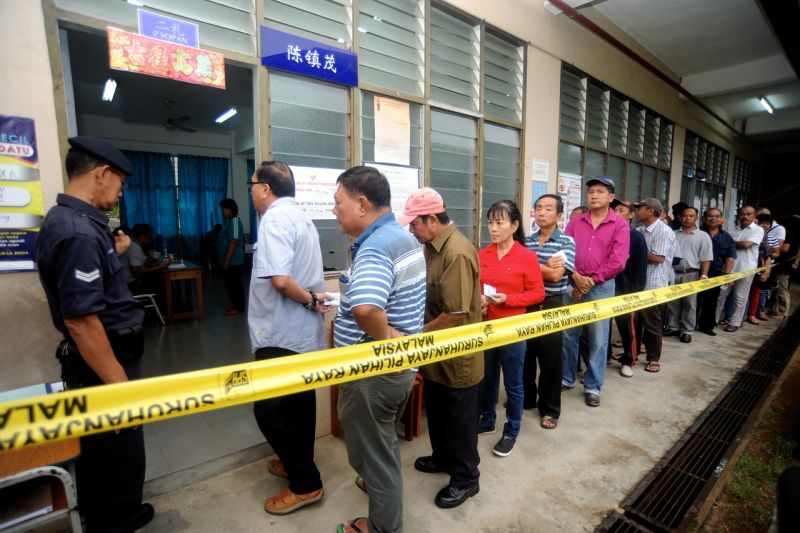 Voters are seen queuing up to cast their votes at a polling centre in Lundu. u00e2u20acu2022 Bernama picn