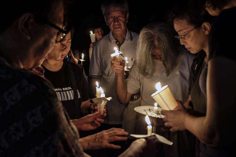 A candlelight vigil for missing Pastor Raymond Koh is held outside the Selangor police headquarters in Shah Alam, March 5, 2017. u00e2u20acu201d Picture by Yusof Mat Isa