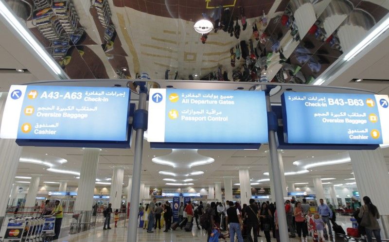 Travellers are seen at the Emirates terminal at Dubai International Airport. u00e2u20acu2022 Reuters pic