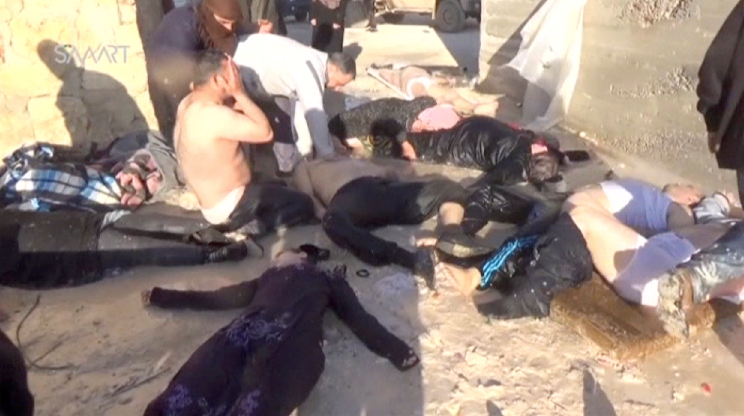 A still image taken from a video posted to a social media website on April 4, 2017, shows people lying on the ground said to be in the town of Khan Sheikhoun, after what rescue workers described as a suspected gas attack in rebel-held Idlib, Syria. Social