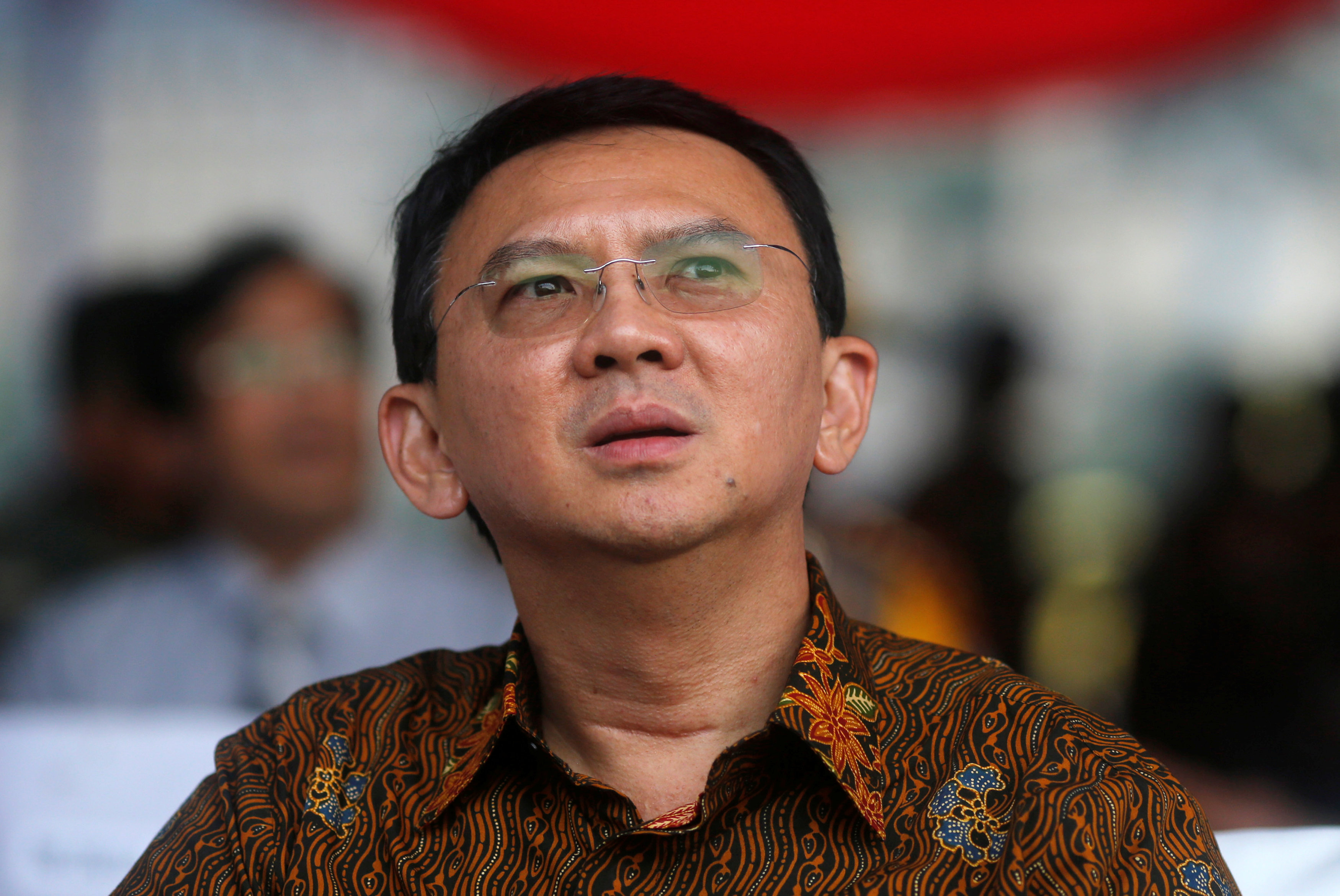 Basuki Tjahaja Purnama, the candidate in Jakarta governor election looks on during Peace Declaration ceremony for Wednesday election in Jakarta, Indonesia, April 17, 2017. REUTERS/Beawihartan