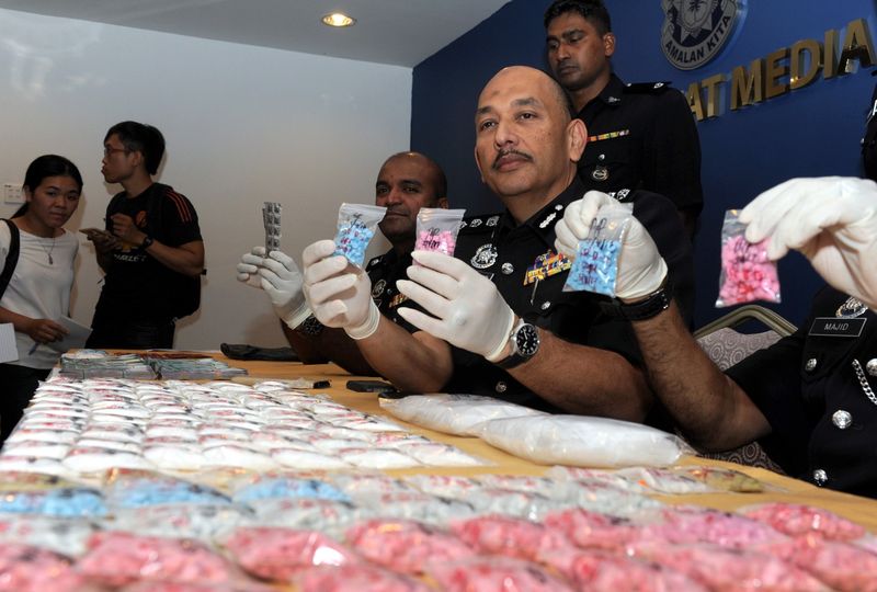Northeast District police chief ACP Mior Faridalathrash Wahid showing the seizure of various drugs worth RM222,000 and RM70,000 in cash at police headquarters in George Town, April 6, 2017. u00e2u20acu201d Bernama pic   