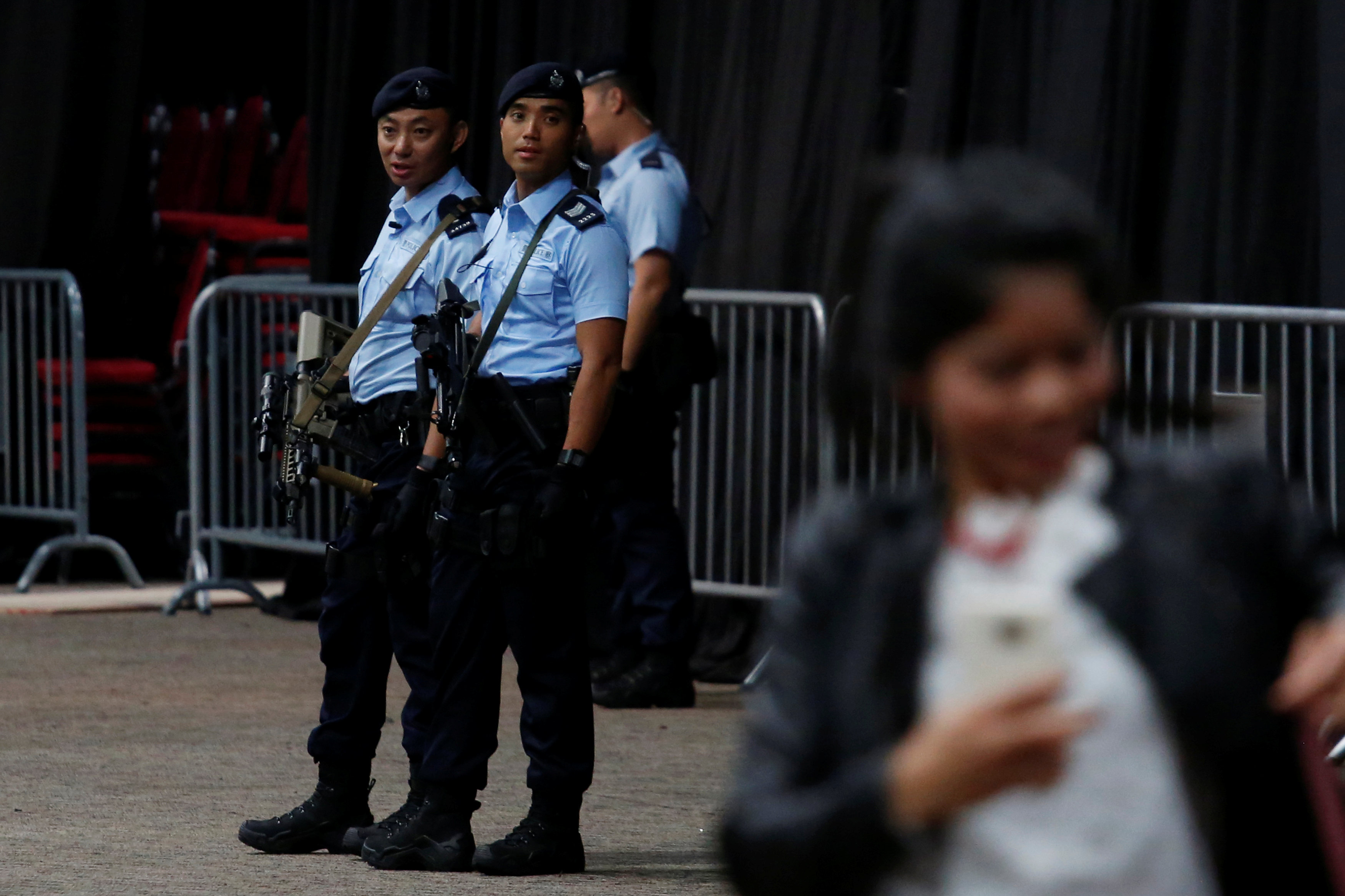 Police patrol at a security checkpoint for the arrival of Indonesian President Joko ,Jokowi, Widodo, before the start of a ceremony in Hong Kong, China April 30, 2017. REUTERS/Bobby Yipn