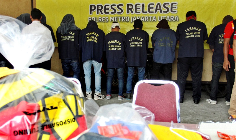 Some of the more than 140 men detained after a raid on what authorities described as a gay prostitution ring being run out of an entertainment venue are shown to the media at a police station in Jakarta, Indonesia May 22, 2017 in this photo taken by Antar