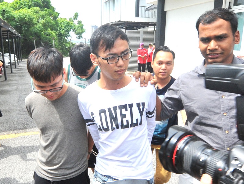 Police arrested JJPTR founder Johnson Lee (left) and his two senior aides in Petaling Jaya May 16, 2017. 