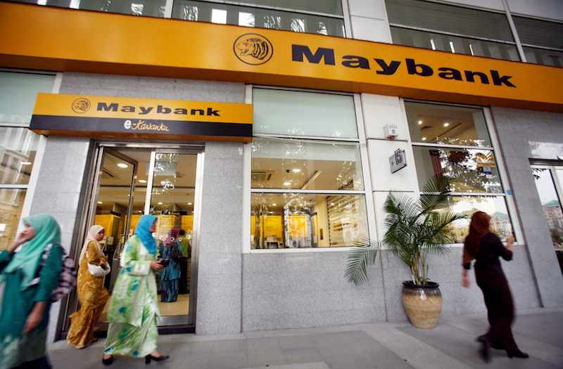 Customers leave a branch of Malaysia's Maybank in Putrajaya October 9, 2009.  u00e2u20acu201d Reuters pic 