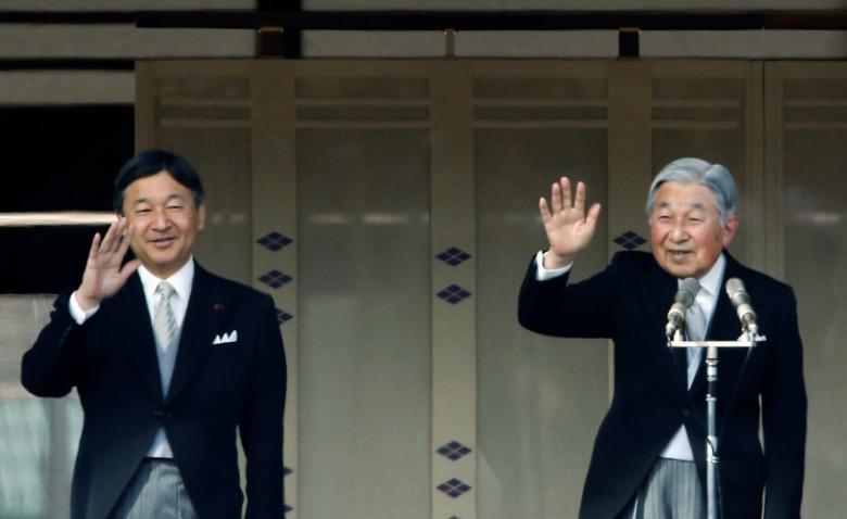 Japan's Emperor Akihito (right) waves to well-wishers beside his son, Crown Prince Naruhito, from a balcony at the Imperial Palace in Tokyo December 23, 2017. u00e2u20acu201d AFP pic