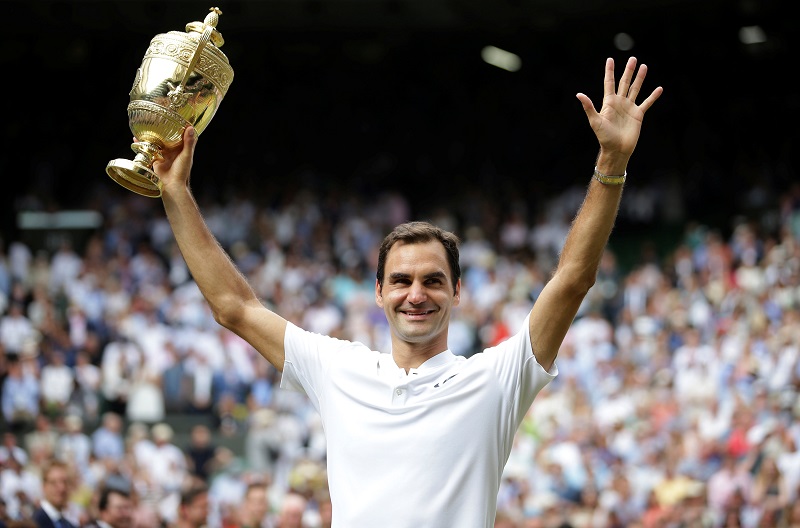 Switzerlandu00e2u20acu2122s Roger Federer poses with the trophy as he celebrates winning the final against Croatiau00e2u20acu2122s Marin Cilic in London July 16, 2017. u00e2u20acu201d Reuters pic