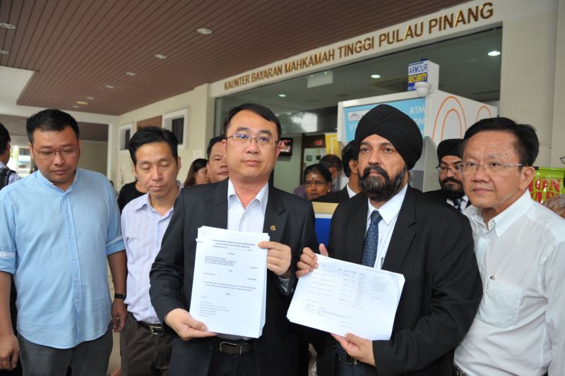 Datuk Liang Teck Meng (third left) and Datuk Baljit Singh (second right) outside the court after filing a defamation suit against Lim Guan Eng. u00e2u20acu2022 Picture by KE Ooi