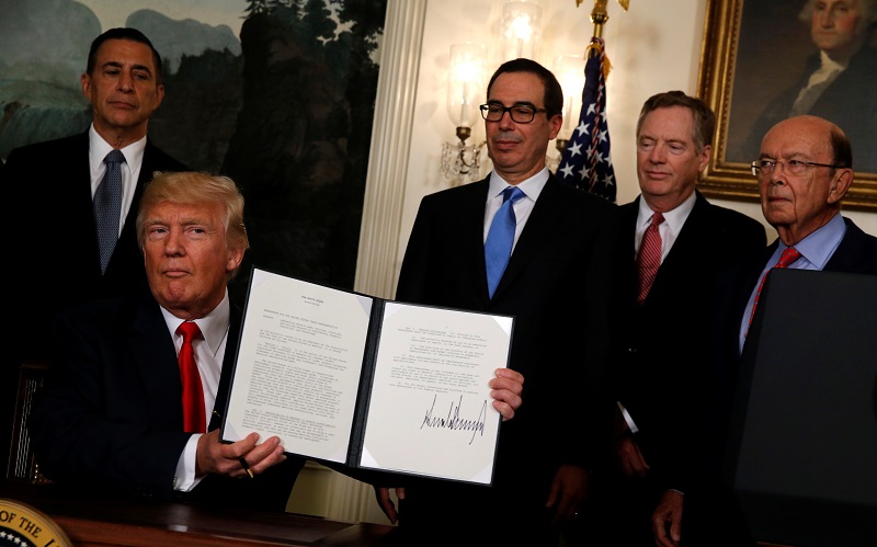 U.S. President Donald Trump responds to a reporter's question after signing a memorandum directing the U.S. Trade Representative to complete a review of trade issues with China at the White House in Washington, U.S. August 14, 2017. REUTERS/Jonathan Ernst