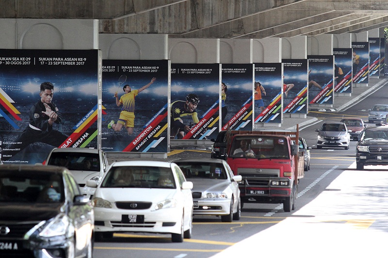 Billboards featuring pictures of athletes is seen along the road near KL Sport City ahead of the KL 2017 Sea Games in Bukit Jalil, Kuala Lumpur Aug 8, 2017. u00e2u20acu201d Picture by Miera Zulyana