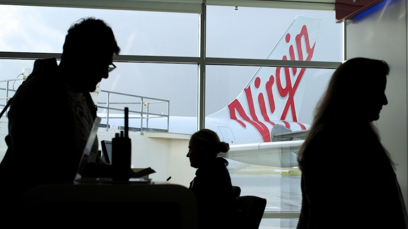 Passengers on a Perth-bound Virgin Australia flight board their aircraft at Sydney's Airport in Australia, August 5, 2016. u00e2u20acu201d Reuters pic 