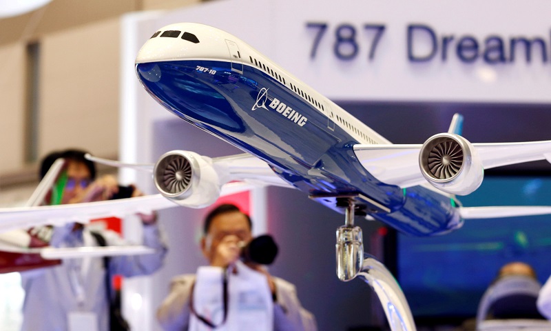 Visitors take pictures of a model of Boeing's 787 Dreamliner during Japan Aerospace 2016 air show in Tokyo, Japan, October 12, 2016. REUTERS/Kim Kyung-Hoon/File Photo