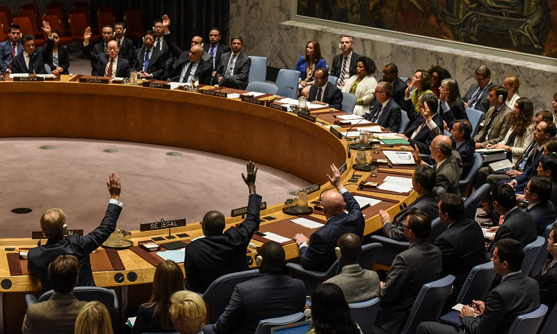 Ambassadors to the UN vote during a United Nations Security Council meeting on North Korea in New York City, U.S., September 11, 2017. REUTERS/Stephanie Keith