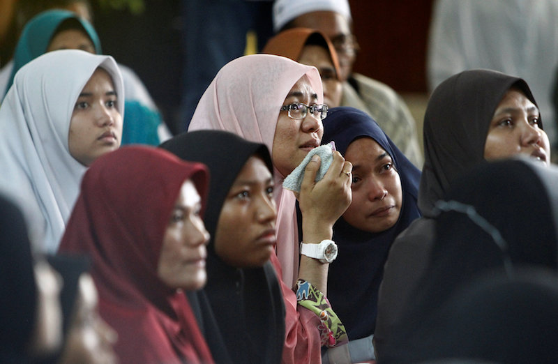 Family members wait for news of their loved ones outside religious school Darul Quran Ittifaqiyah after a fire broke out in Kuala Lumpur September 14, 2017. u00e2u20acu201d Reuters pic