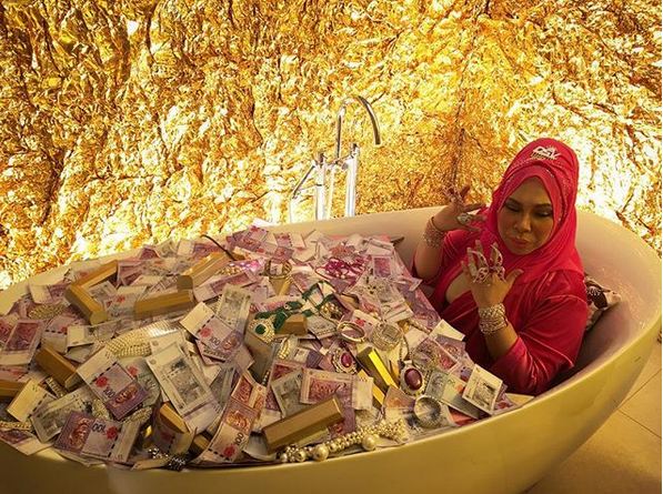 The image of Vida bathing in a pool of cash has drawn criticism from social media users. u00e2u20acu201d Instagram screengrab