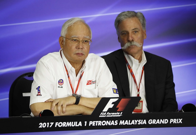 Prime Minister Datuk Seri Najib Razak looks on next to Formula One Chief Chase Carey during news conference in Sepang October 1, 2017. u00e2u20acu201d Reuters pic